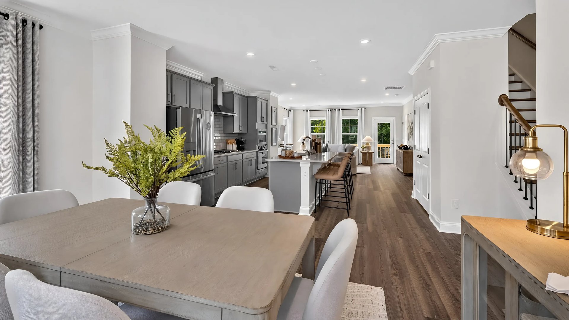 Dining area with open line of sight to kitchen and family room (Westmore (Dining) in Townes at the Station)