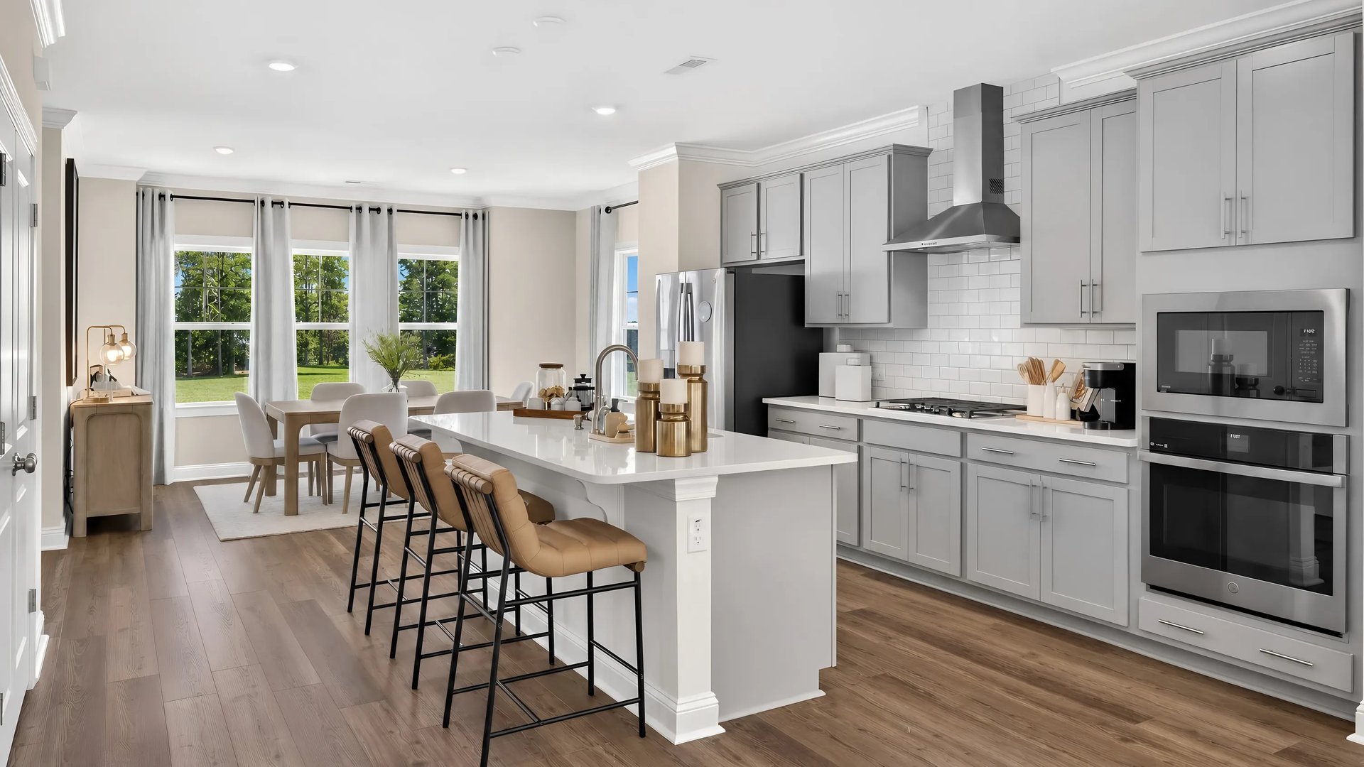 Kitchen with center island and appliances (Westmore (Kitchen) in Townes at the Station)